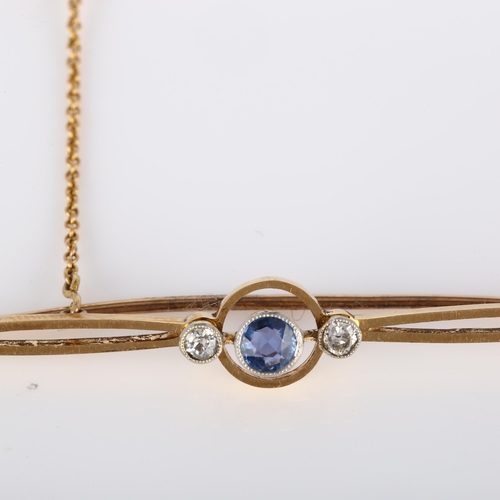 222 - An Art Deco 15ct gold three stone sapphire and diamond bar brooch, brooch length 53.6mm, 3.2g