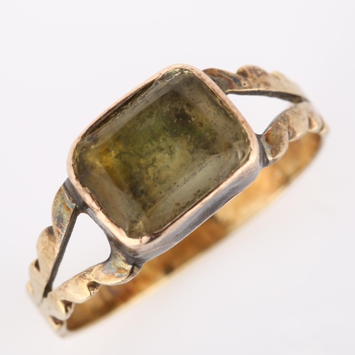 242 - A Victorian foil-backed quartz dress ring, unmarked gold closed-back settings with cushion-cut quart... 