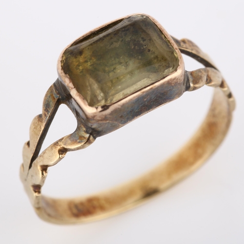 242 - A Victorian foil-backed quartz dress ring, unmarked gold closed-back settings with cushion-cut quart... 