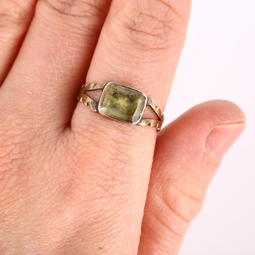 242 - A Victorian foil-backed quartz dress ring, unmarked gold closed-back settings with cushion-cut quart... 