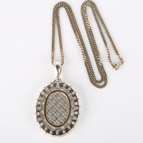 247 - A Victorian photo locket pendant necklace, unmarked silver settings with applied two-colour gold flo... 