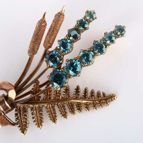 249 - A late 20th century 9ct gold blue zircon floral brooch, with fern and bulrush decoration, maker's ma... 