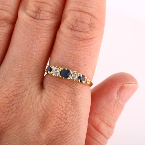 257 - An early/mid-20th century 18ct gold graduated five stone sapphire and diamond half hoop ring, settin... 