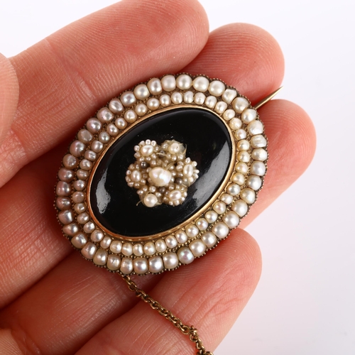 260 - A Victorian onyx and pearl cluster mourning brooch, unmarked gold settings, and an Antique gilt-meta... 