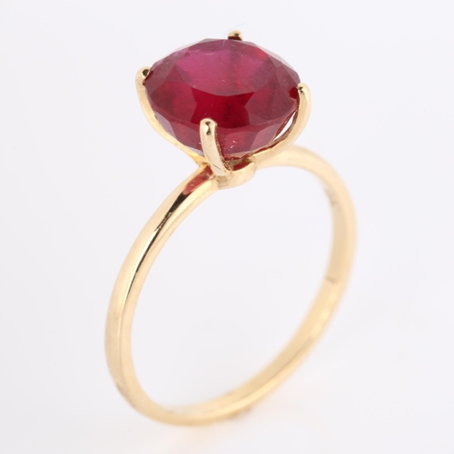 273 - A modern 9ct gold synthetic ruby dress ring, set with modern round brilliant-cut ruby, diameter 15.1... 