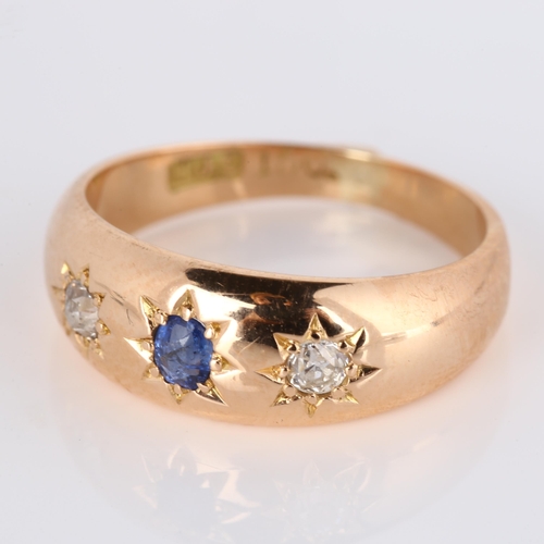 279 - An early 20th century 15ct rose gold three stone sapphire and diamond gypsy ring, total diamond cont... 