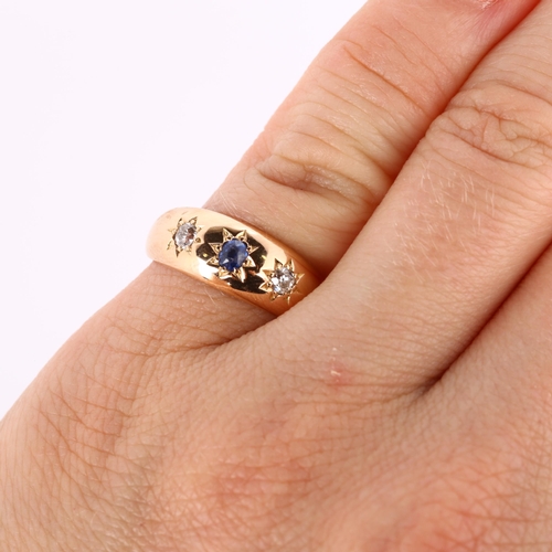 279 - An early 20th century 15ct rose gold three stone sapphire and diamond gypsy ring, total diamond cont... 