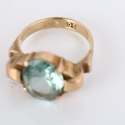 284 - A 9ct rose gold green zircon dress ring, set with oval mixed-cut zircon which measures 11.33mm x 9.1... 