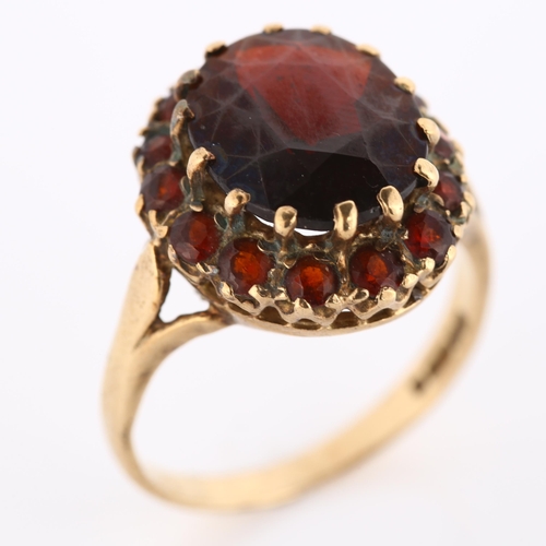 287 - A late 20th century 9ct gold garnet cluster dress ring, setting height 16.6mm, size O, 4.6g