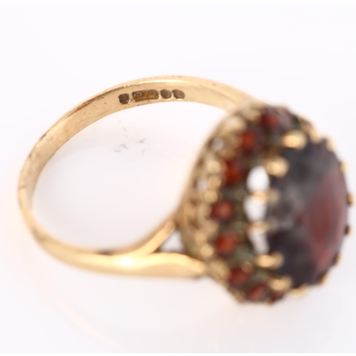 287 - A late 20th century 9ct gold garnet cluster dress ring, setting height 16.6mm, size O, 4.6g