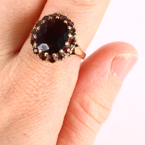 287 - A late 20th century 9ct gold garnet cluster dress ring, setting height 16.6mm, size O, 4.6g