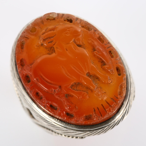 294 - A large Eastern silver carnelian Sagittarius cameo ring, setting height 33.2mm, size Z+, 27.1g