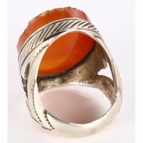 294 - A large Eastern silver carnelian Sagittarius cameo ring, setting height 33.2mm, size Z+, 27.1g