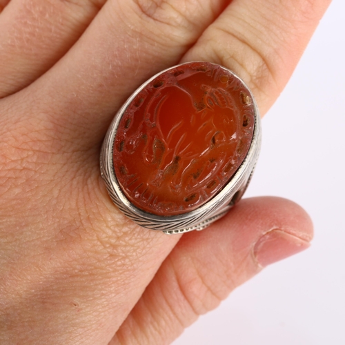 294 - A large Eastern silver carnelian Sagittarius cameo ring, setting height 33.2mm, size Z+, 27.1g