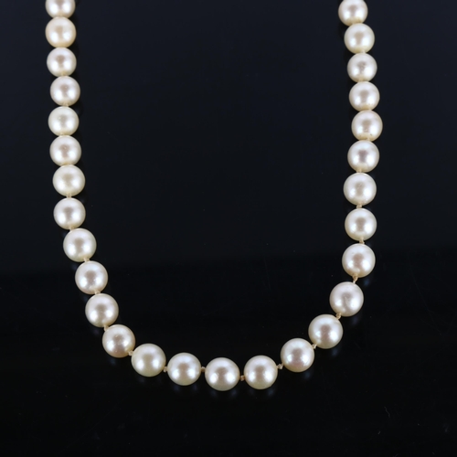 295 - A late 20th century single-strand pearl necklace, with 18ct white gold sapphire clasp, pearl diamete... 