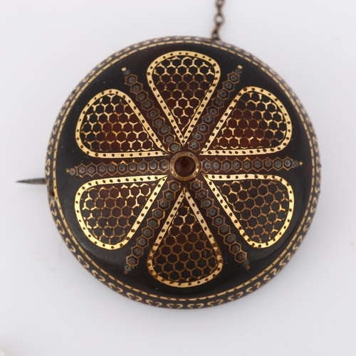 297 - A Victorian tortoiseshell gold and silver pique inlaid bombe shield brooch, diameter 40.9mm, 10g