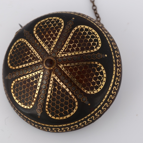 297 - A Victorian tortoiseshell gold and silver pique inlaid bombe shield brooch, diameter 40.9mm, 10g