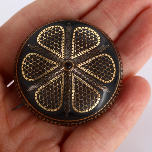 297 - A Victorian tortoiseshell gold and silver pique inlaid bombe shield brooch, diameter 40.9mm, 10g