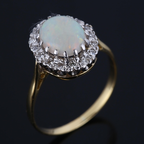 298 - An 18ct gold opal and diamond cluster ring, set with oval cabochon opal and single-cut diamonds, set... 