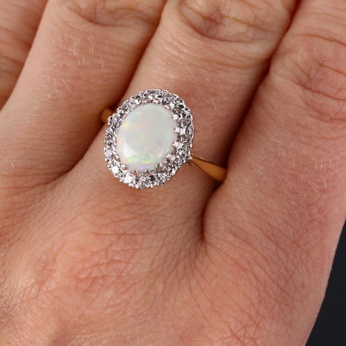 298 - An 18ct gold opal and diamond cluster ring, set with oval cabochon opal and single-cut diamonds, set... 