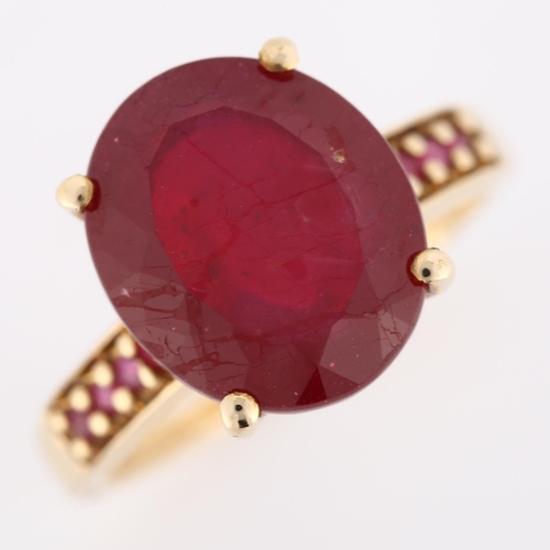 300 - A modern 9ct gold ruby dress ring, with ruby shoulders, ruby length 13.2mm, size N, 4.5g