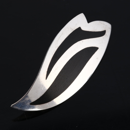 315 - KAI ERLING FEILING - a Danish modernist sterling silver and black enamel wing brooch, model no. 637,... 