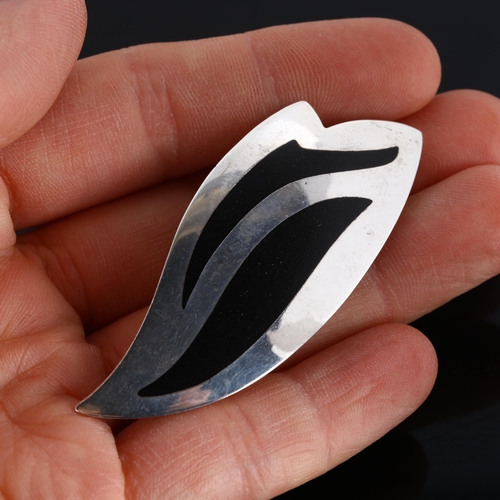 315 - KAI ERLING FEILING - a Danish modernist sterling silver and black enamel wing brooch, model no. 637,... 