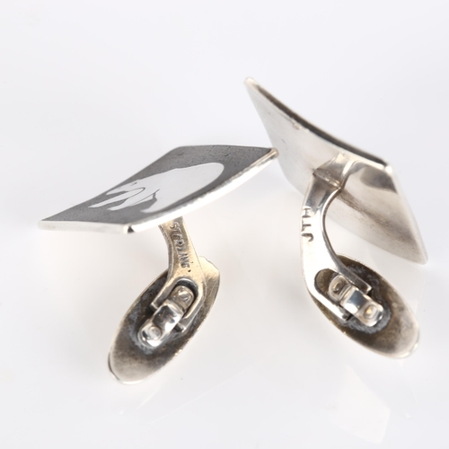 317 - JENS TAGE HANSEN - a pair of Danish modernist sterling silver and black enamel polar bear cufflinks,... 