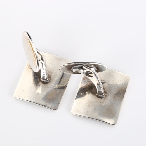 317 - JENS TAGE HANSEN - a pair of Danish modernist sterling silver and black enamel polar bear cufflinks,... 