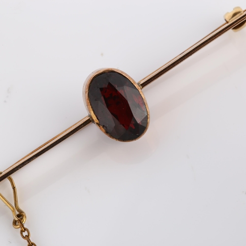 319 - An early 20th century garnet bar brooch, unmarked rose gold settings with oval mixed-cut garnet, bro... 