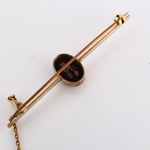 319 - An early 20th century garnet bar brooch, unmarked rose gold settings with oval mixed-cut garnet, bro... 