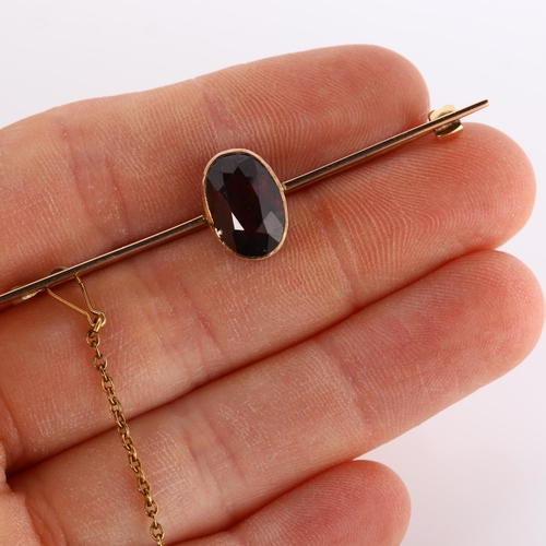 319 - An early 20th century garnet bar brooch, unmarked rose gold settings with oval mixed-cut garnet, bro... 