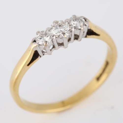 329 - An 18ct gold three stone diamond ring, set with modern round brilliant-cut diamonds, total diamond c... 