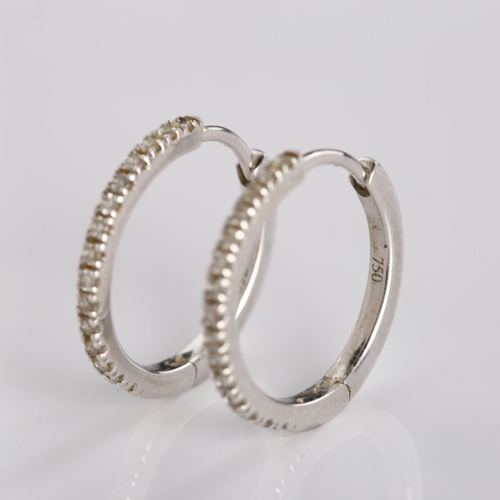 354 - A pair of 18ct white gold diamond hoop earrings, set with modern round brilliant-cut diamonds, hoop ... 