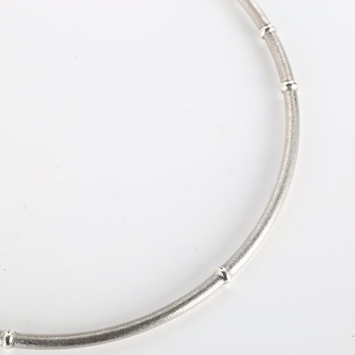 375 - LAPPONIA - a Finnish sterling silver necklace, segmented form with textured ground and raised bands,... 