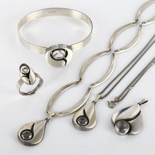 391 - A group of Finnish sterling silver and cubic zirconia jewellery, comprising 3 pendant necklaces, 1 t... 