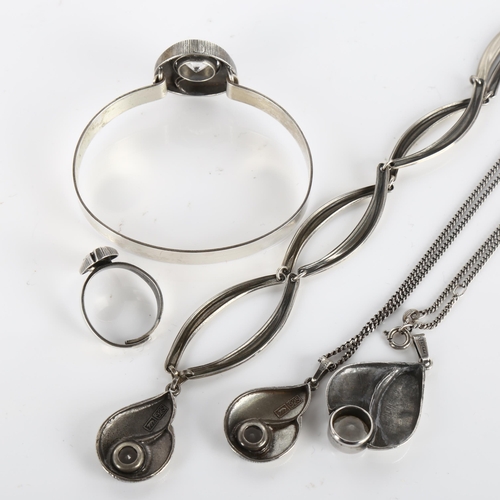 391 - A group of Finnish sterling silver and cubic zirconia jewellery, comprising 3 pendant necklaces, 1 t... 