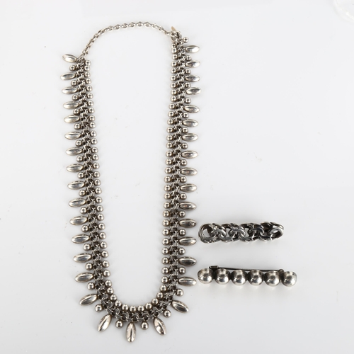 392 - HERMANN SIERSBOL - a Danish stylised sterling silver fringe necklace, length 45cm, and 2 Danish unna... 