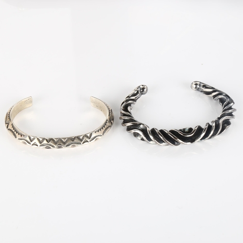 407 - A Mexican silver torque bangle, 33.4g, and a Continental unmarked white metal wavy bangle, 52.5g (2)