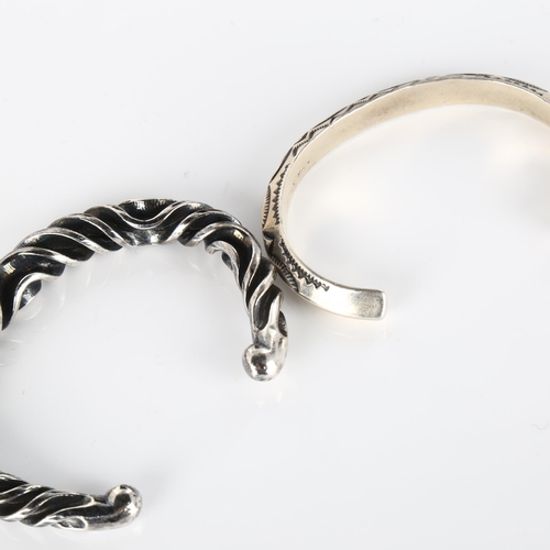 407 - A Mexican silver torque bangle, 33.4g, and a Continental unmarked white metal wavy bangle, 52.5g (2)