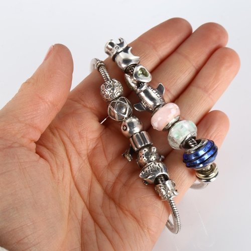 413 - 2 modern silver snake link charm bracelets and various charms, including Pandora, 74.5g total (2)