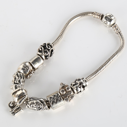 414 - PANDORA - a modern sterling silver snake link charm bracelet, with 9 silver charms, length 19cm, 42.... 