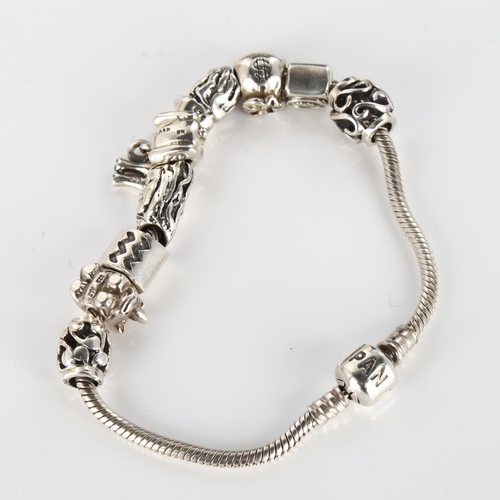 414 - PANDORA - a modern sterling silver snake link charm bracelet, with 9 silver charms, length 19cm, 42.... 