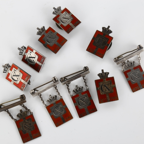 416 - GEORG JENSEN - 10 Danish silver and red enamel Kingmark badges and brooches, height 24.1mm, 36.6g to... 