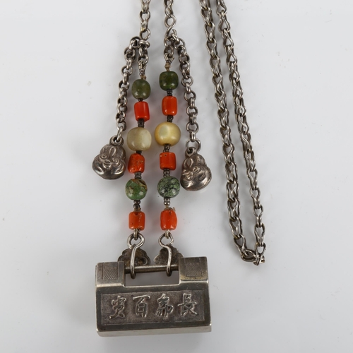 417 - A Chinese silver padlock pendant necklace with coral and mother-of-pearl, necklace length 66cm, 75.7... 