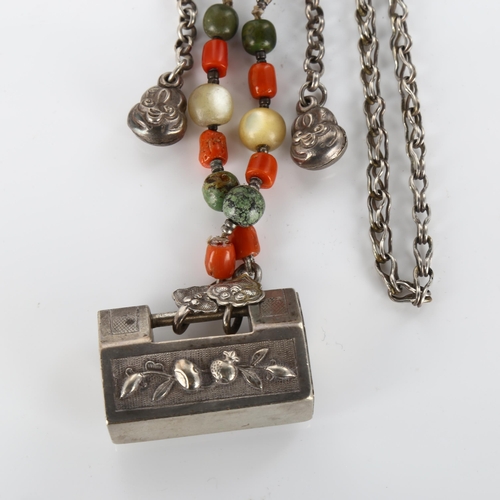 417 - A Chinese silver padlock pendant necklace with coral and mother-of-pearl, necklace length 66cm, 75.7... 