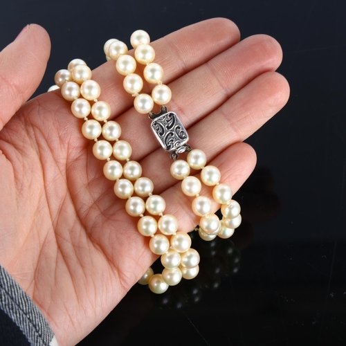 425 - A Vintage double-strand cultured pearl necklace, with 9ct white gold clasp, necklace length 40cm, 49... 