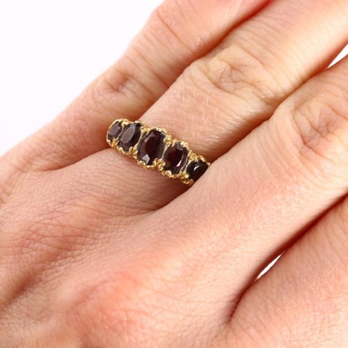 435 - A late 20th century 9ct gold graduated five stone garnet half hoop ring, hallmarks London 1971, sett... 