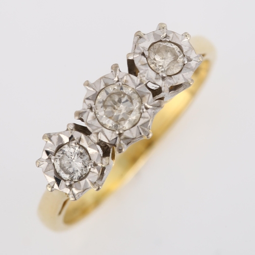 436 - An 18ct gold three stone diamond ring, illusion set with modern round brilliant-cut diamonds, total ... 