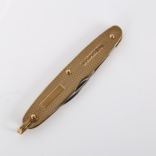 437 - A late 20th century 9ct gold penknife, allover engine turned decoration, makers marks SJR, hallmarks... 